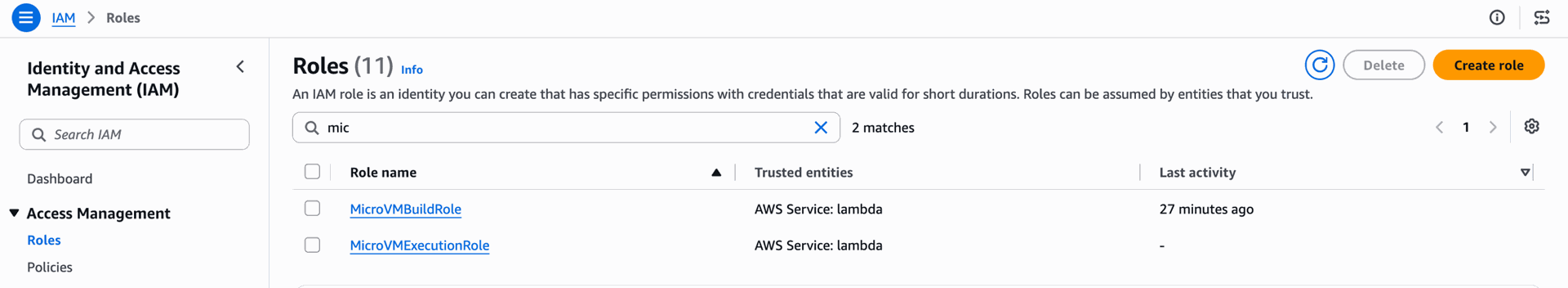 MicroVMBuildRole and MicroVMExecutionRole in the IAM Roles console, both trusting the lambda service