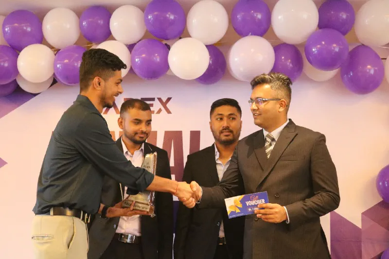 Saugat receiving the Extra Mile Champion award at Adex International